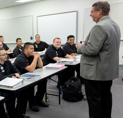 image of faculty teaching in classroom of students